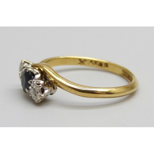 944 - An 18ct yellow gold, diamond and sapphire ring, 2.7g, L