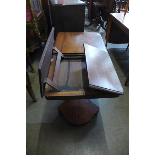 103 - A Victorian mahogany adjustable double sided reading table