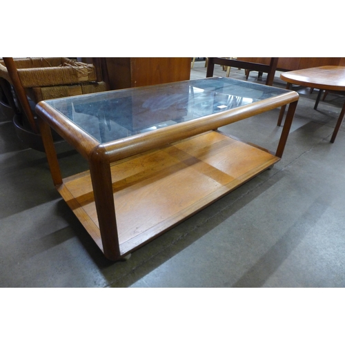 11 - A G-Plan Fresco teak and glass topped coffee table