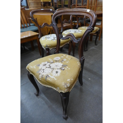 110 - A set of four Victorian rosewood kidney back dining chairs