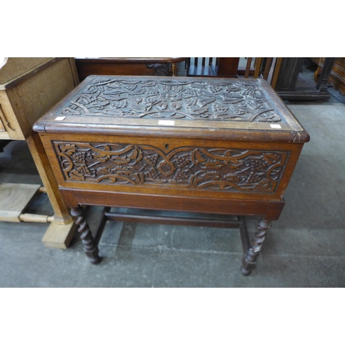 139 - A 17th Century style carved oak box on barleytwist stand