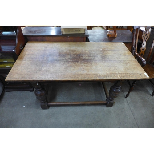 158 - A 17th Century style oak refectory table