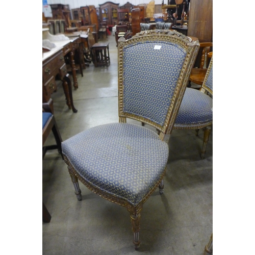 173 - A set of six early 20th Century French cream and parcel gilt dining chairs