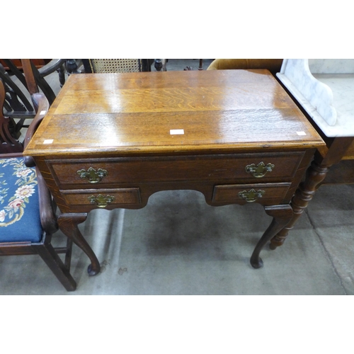 182 - A George III oak lowboy