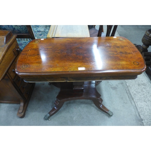 187 - A Victorian figured walnut and Tunbridgeware inlaid fold over games table, on associated base