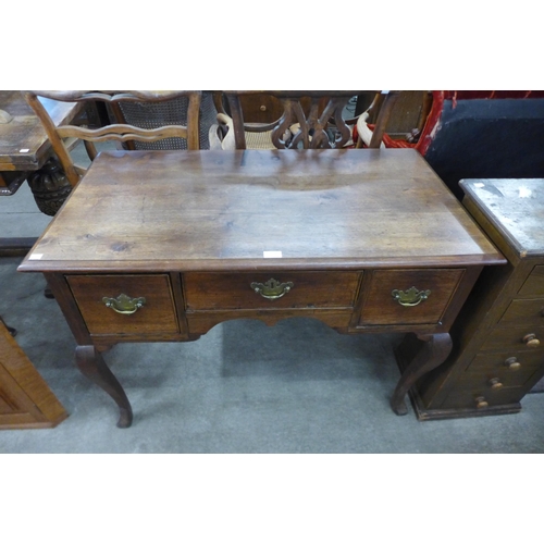 193 - A George III mahogany three drawer side table