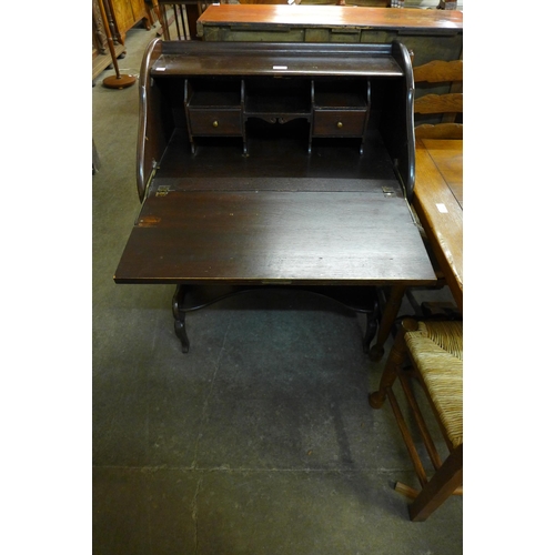 205 - An Art Nouveau carved mahogany bureau de dame and a chair