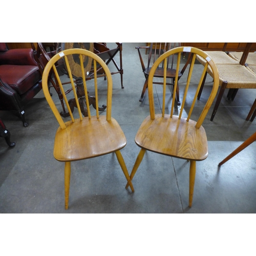 23 - A pair of Ercol Blonde elm and beech Windsor chairs