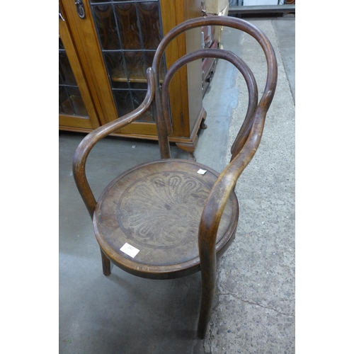 242 - A child's beech bentwood armchair