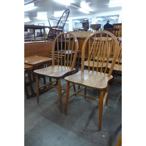 38 - A pair of Ercol Blonde elm and beech Windsor chairs