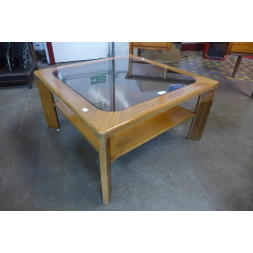 51 - A Nathan teak and glass topped square coffee table