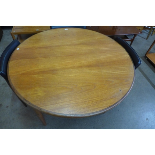 9 - A G-Plan Fresco teak circular extending dining table and four chairs