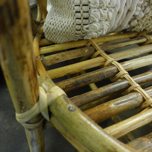 1370 - A cane chair with cushion  * This lot is subject to VAT