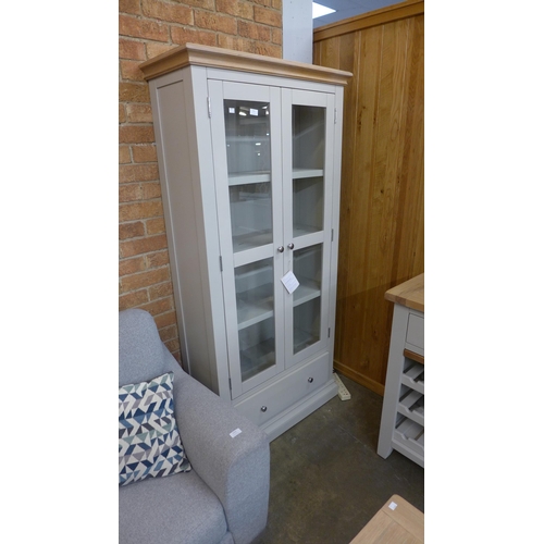 1396 - A one drawer two door glazed display cabinet  * This lot is subject to VAT