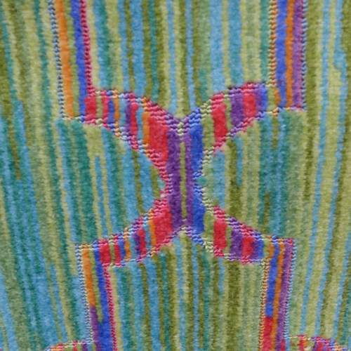 1553 - A green ground designer carpet with all over multi-coloured contemporary design, 200cm x 300cm