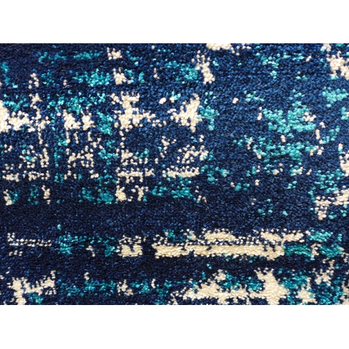 1566 - A blue ground Turkish carpet with all over contemporary design, 300cm x 200cm