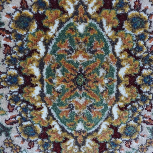 1616 - A fine woven, rich red ground full pile Turkish runner with floral medallion design