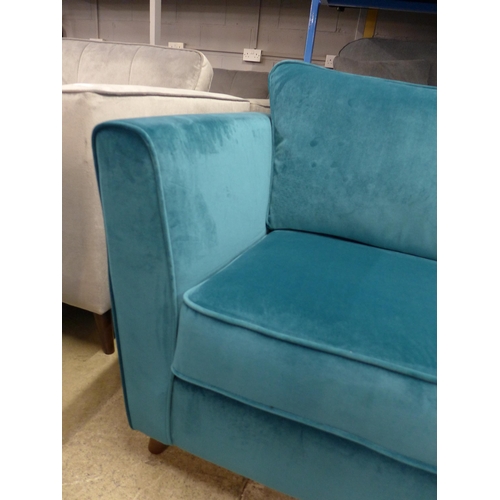 1421 - A turquoise velvet two seater sofa