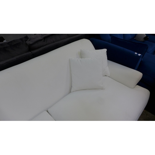 1431 - A white velvet three seater sofa