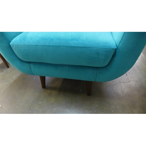 1433 - A turquoise velvet armchair