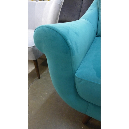 1433 - A turquoise velvet armchair