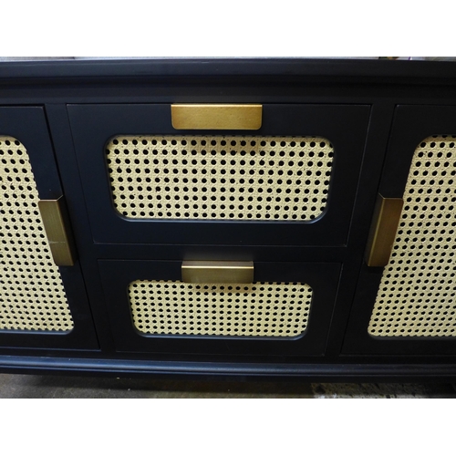 1475 - A black rattan sideboard with two drawers and two doors