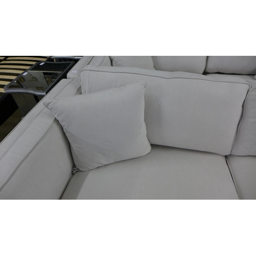 1519 - An ice white upholstered four seater sofa