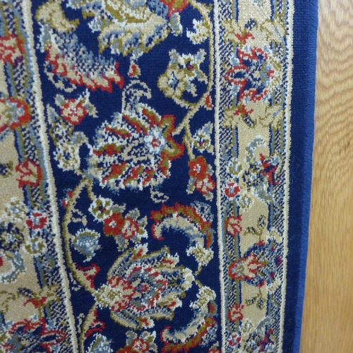 1536 - A rich blue ground full pile Cashmere rug with all over floral design, 230cm x 160cm