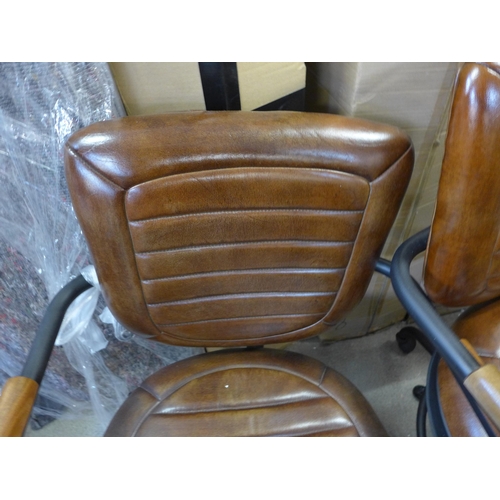 1576 - Two leather swivel chairs - damaged * this lot is subject to VAT