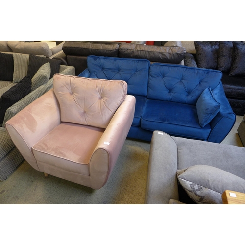 1599 - A blue velvet three seater sofa and a pink armchair - damaged