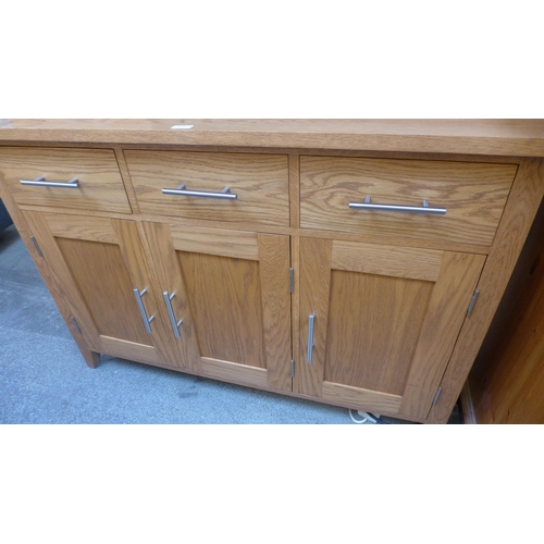 1624 - An oak three-door and three drawer glazed dresser