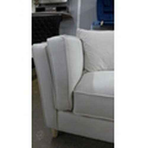 1518 - An ice white upholstered four seater sofa