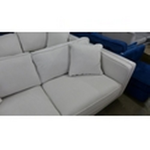 1518 - An ice white upholstered four seater sofa