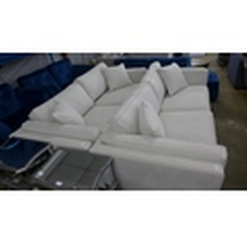 1518 - An ice white upholstered four seater sofa