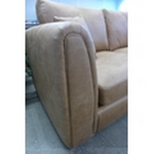 1620 - A tan upholstered four seater sofa