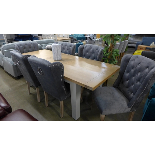 1397 - An extension dining table - 1.8-2.3 with a set of six grey plush velvet studded button back dining c... 