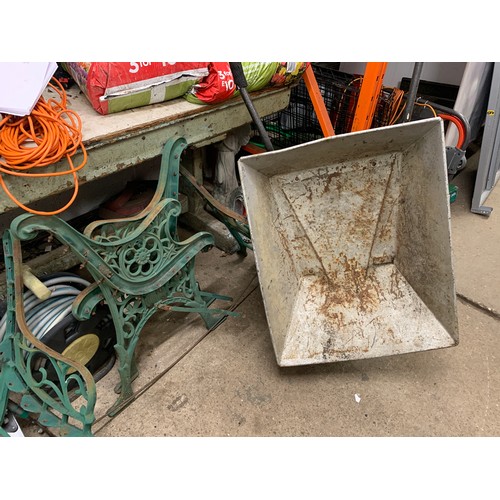 2433 - Steel wheelbarrow and two pairs of vintage floral cast iron bench ends