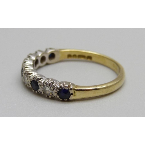 1001 - An 18ct gold, sapphire and diamond band, 3.1g, O