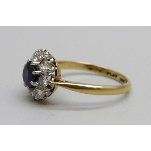 1006 - An 18ct gold, platinum set, sapphire and diamond cluster ring, 2.6g, L