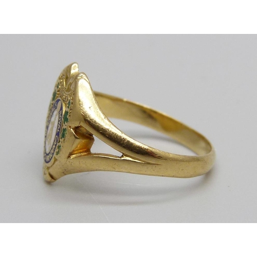 1011 - A yellow metal and enamel ring, Royal Canadian Corps of Signals, personalised and marked 18K, 4.4g, ... 