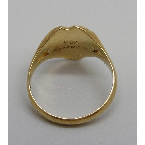 1011 - A yellow metal and enamel ring, Royal Canadian Corps of Signals, personalised and marked 18K, 4.4g, ... 