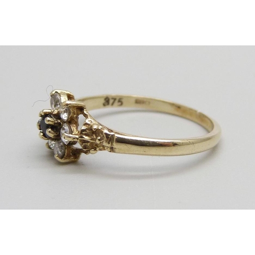 1021 - A 9ct gold, sapphire and white stone cluster ring, 1.4g, L