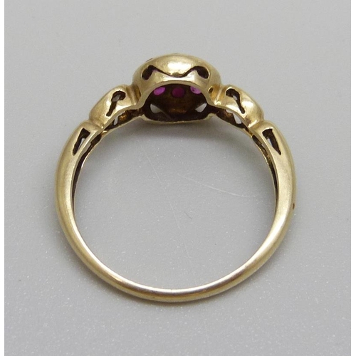 1027 - A 9ct gold, ruby and diamond ring, 1.7g, N