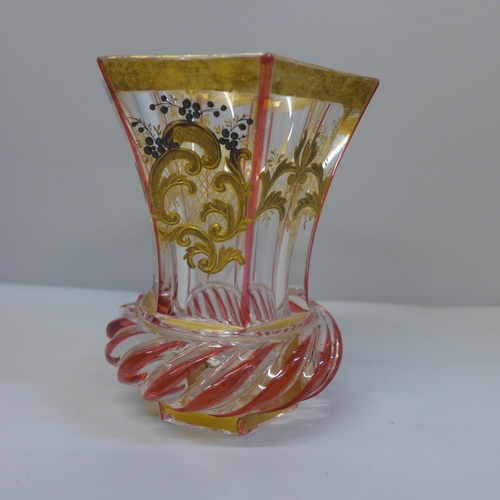 633 - A Bohemian glass beaker with gilded arabesques