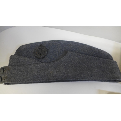 637 - A WWII RAF cap, photograph and a Royal Air Force pocket book