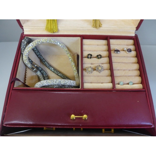 647 - A case of jewellery including some silver