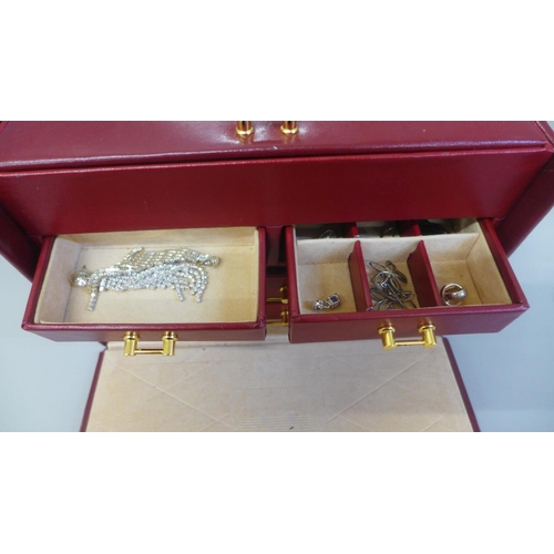 647 - A case of jewellery including some silver