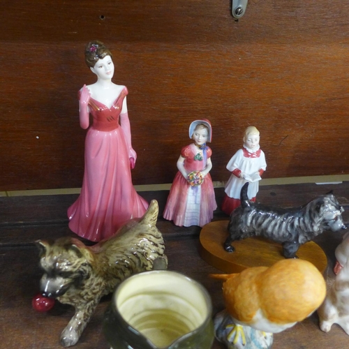 649 - A collection of figures including Royal Doulton, Coalport, and Beswick