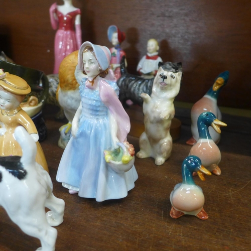 649 - A collection of figures including Royal Doulton, Coalport, and Beswick