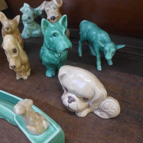 651 - A collection of eight Sylvac dogs and a calf